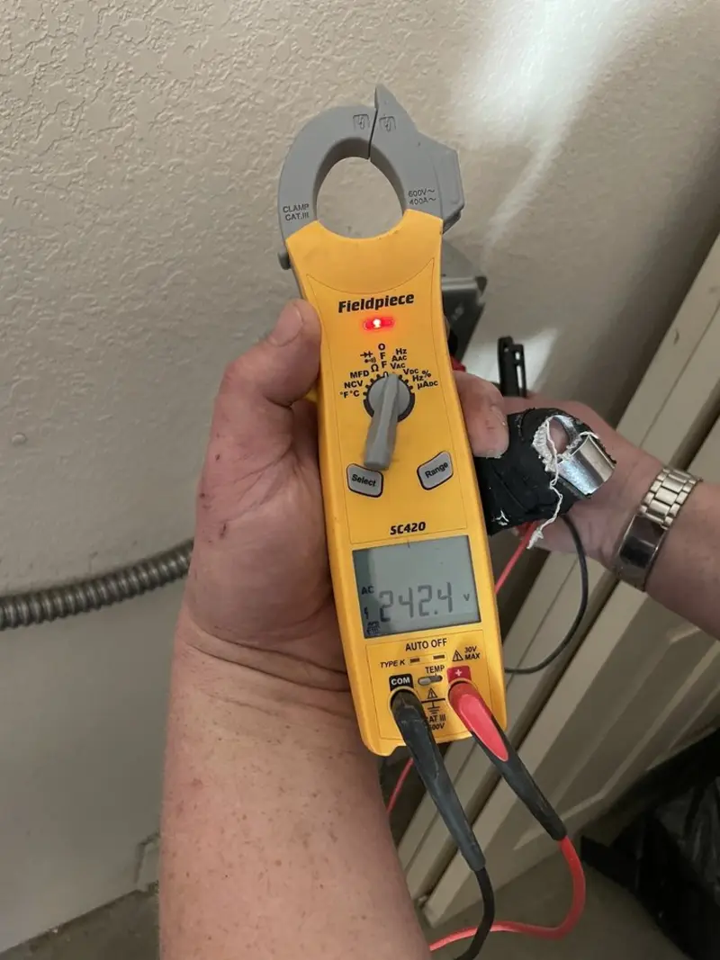 Voltage testing with clamp meter during Outlet Installation in Linden